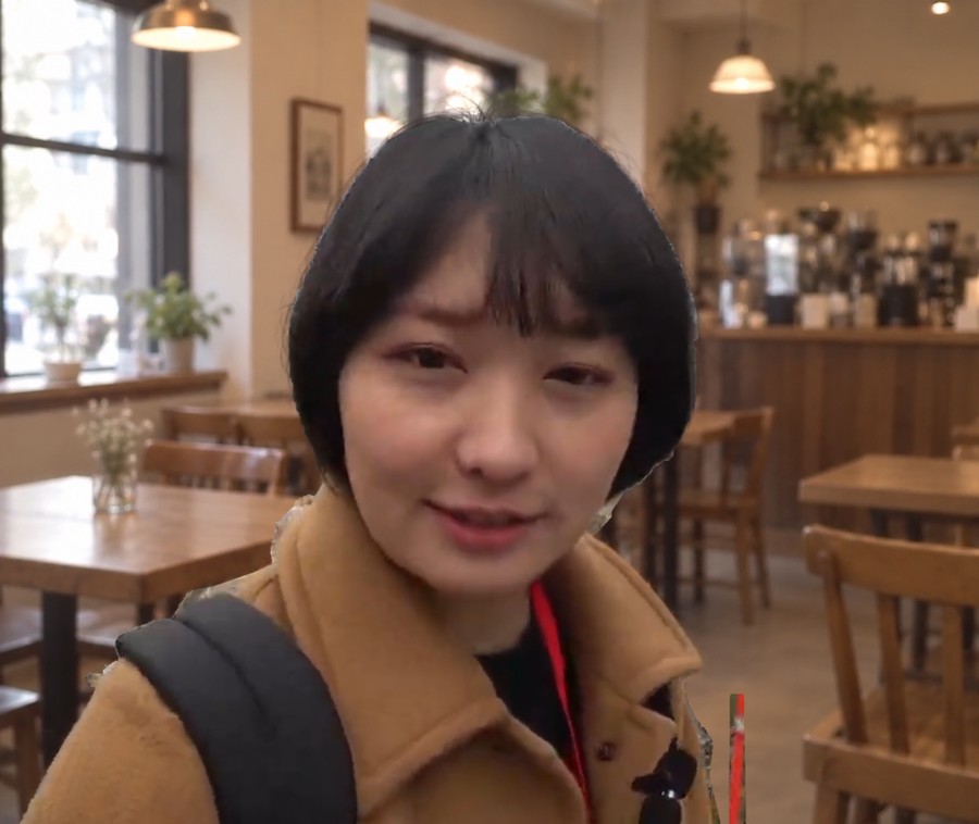 The same portrait with a café background